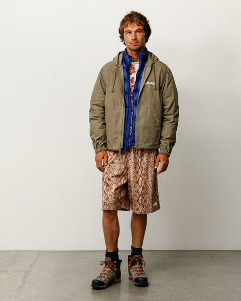 Stüssy 왁스드 코튼 비치 쉘 유니섹스 아우터, 올리브 컬러의 경량 후드 집업 재킷 디자인